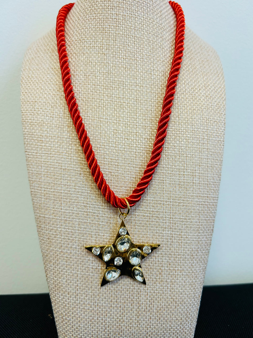 Red rope with gold star necklace